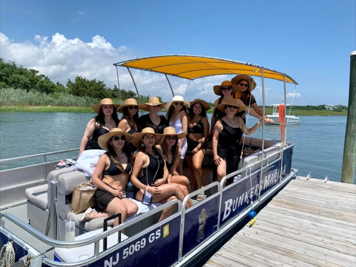 a group of people in a small boat in a body of water