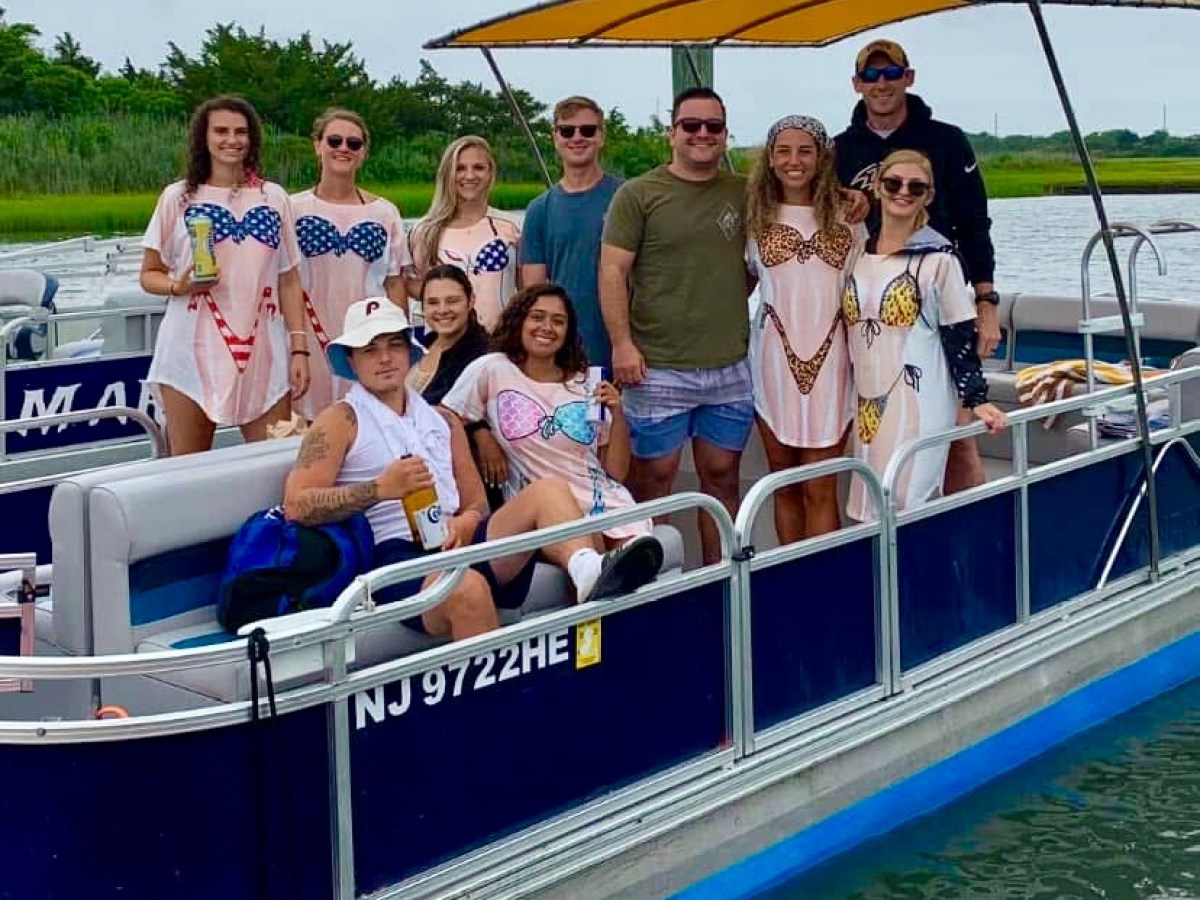 a group of people on a boat in the water