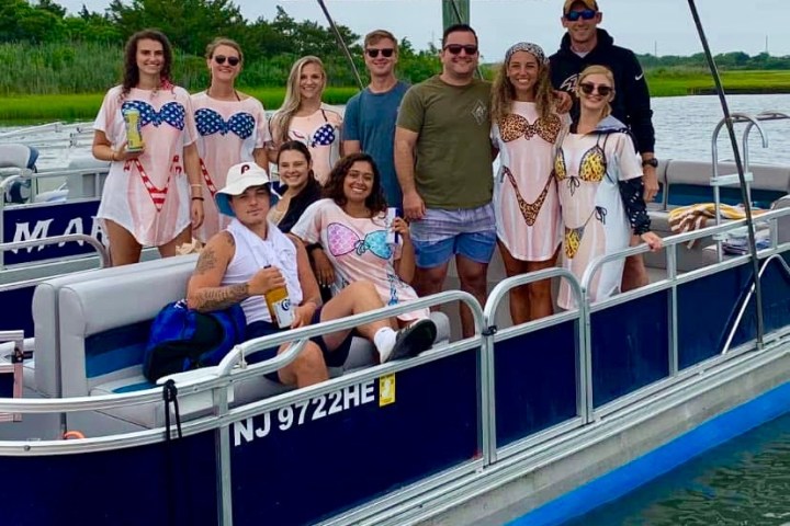 a group of people on a boat in the water